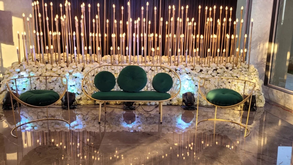 Opulent Candle Wall Sangeet Stage and Emerald Velvet Lounge